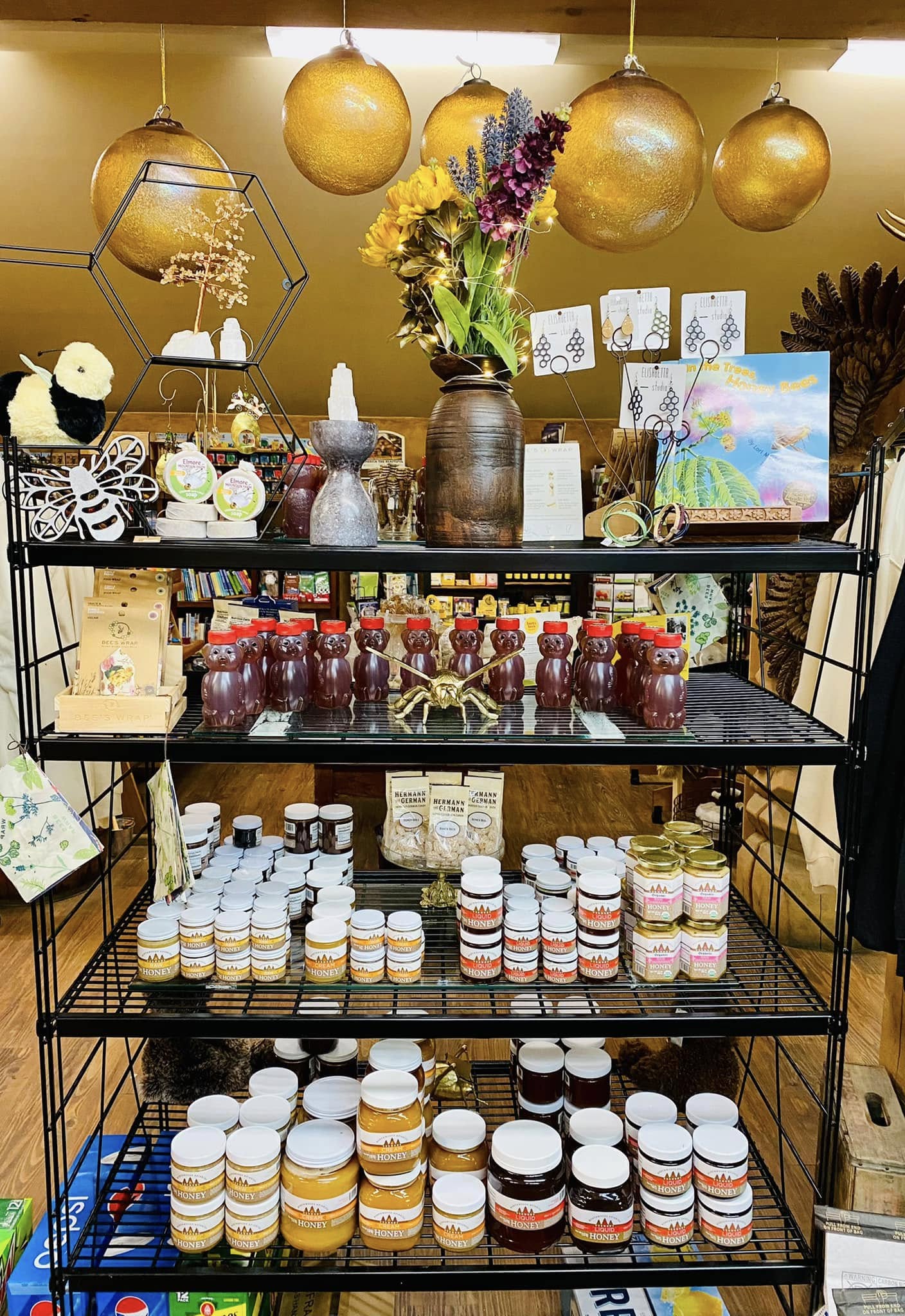 Honey jars and honey-bear bottles on the store shelves